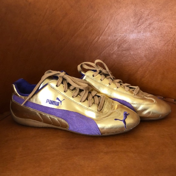 purple and gold puma shoes